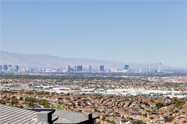 property's view of city with a mountain view