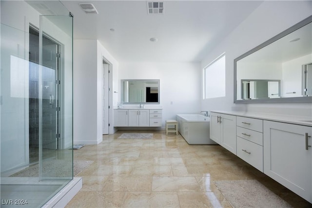 bathroom with vanity and plus walk in shower