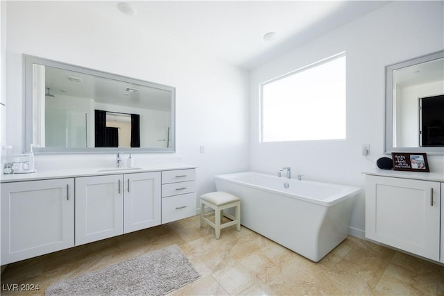 510 Duvet Ct, Henderson, NV 89012 - bathroom featuring a freestanding tub and vanity