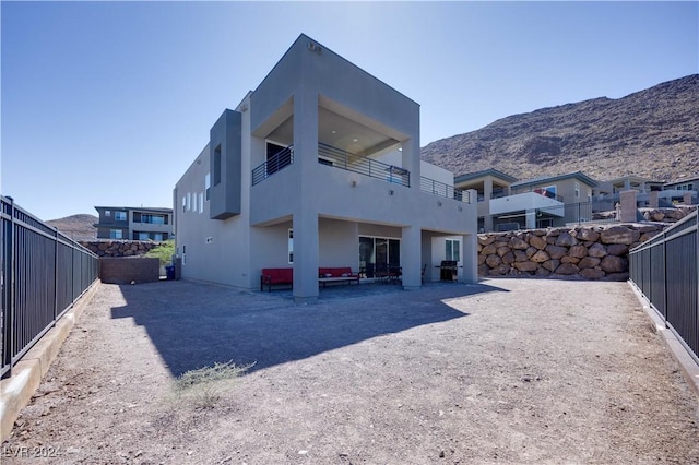 back of property with a mountain view