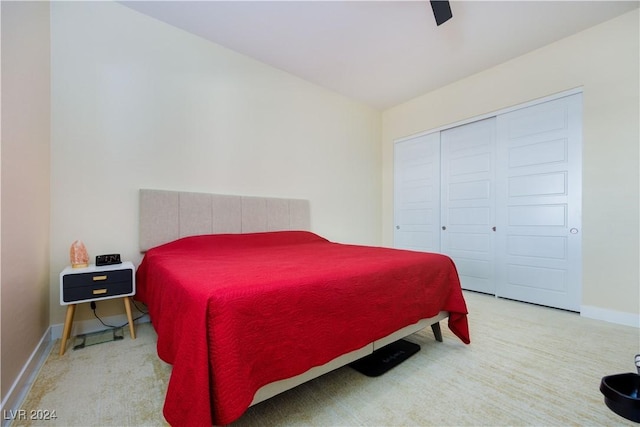 bedroom featuring ceiling fan and a closet