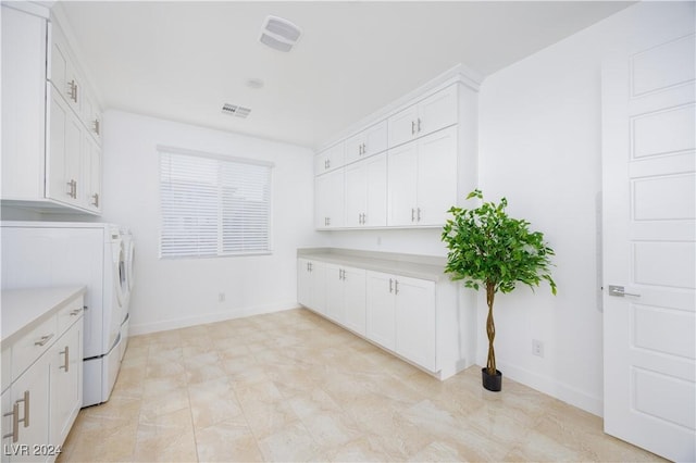 510 Duvet Ct, Henderson, NV 89012 - laundry room featuring separate washer and dryer, baseboards, cabinet space, and visible vents