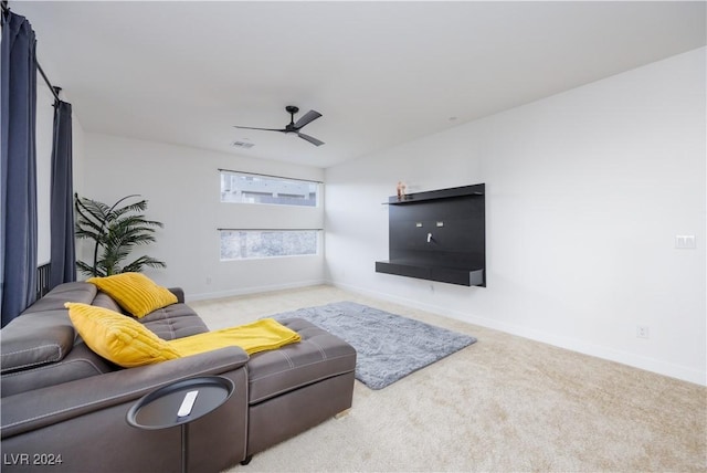 living room featuring ceiling fan and light carpet