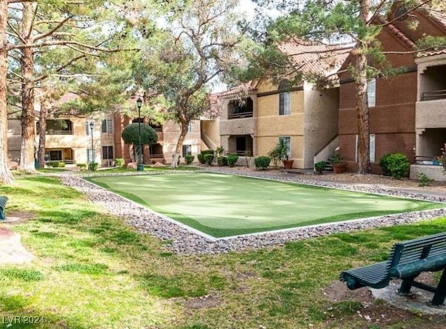 view of community featuring a yard