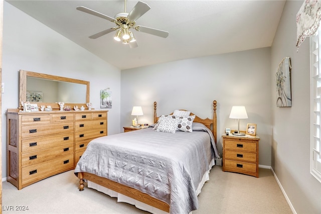 carpeted bedroom with lofted ceiling and ceiling fan