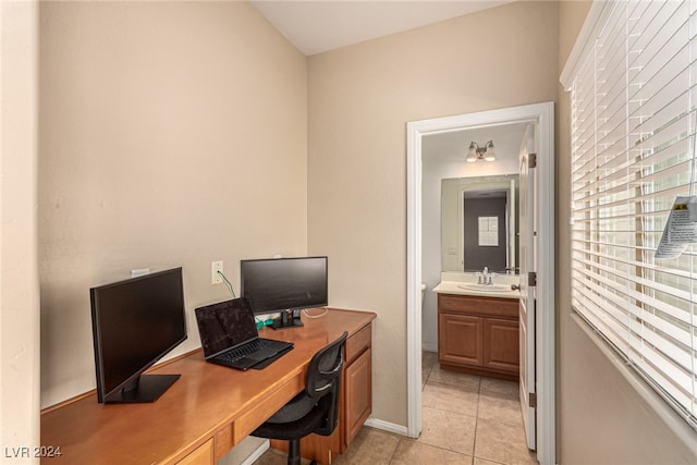 tiled office space featuring sink