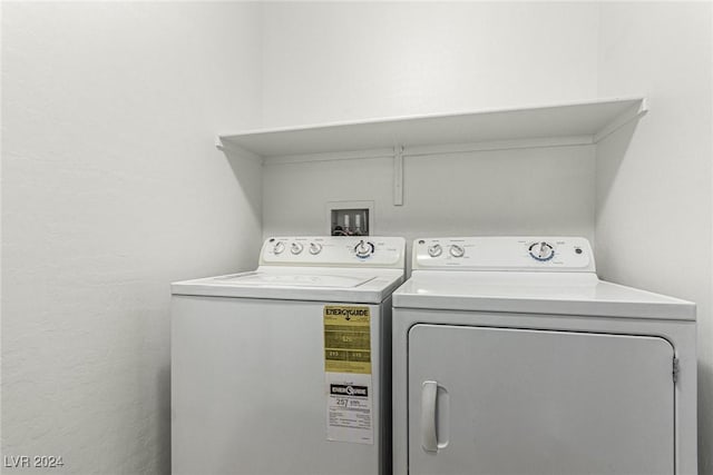 laundry room featuring washing machine and clothes dryer