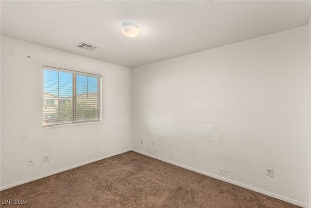 empty room featuring carpet flooring