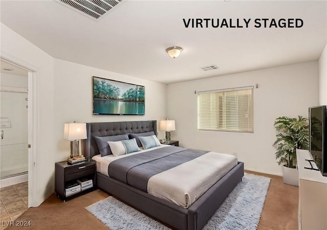 carpeted bedroom featuring connected bathroom