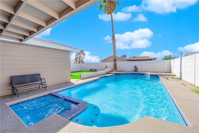 view of swimming pool with a patio area