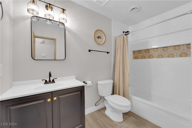 full bathroom with vanity, toilet, hardwood / wood-style floors, and shower / bath combo