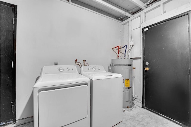 clothes washing area with independent washer and dryer and water heater