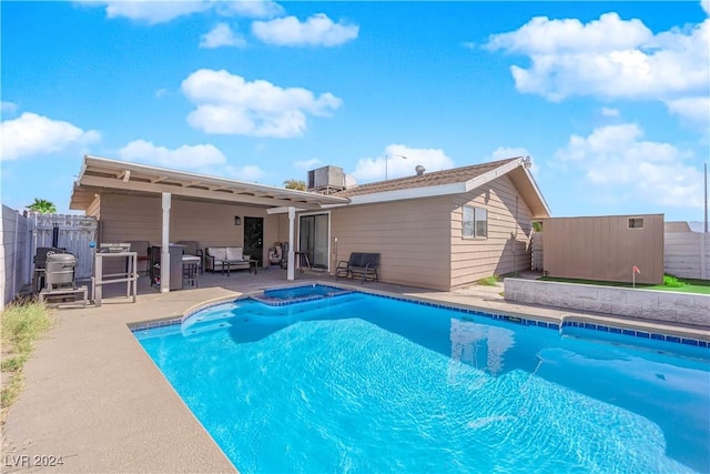 view of swimming pool with a patio area