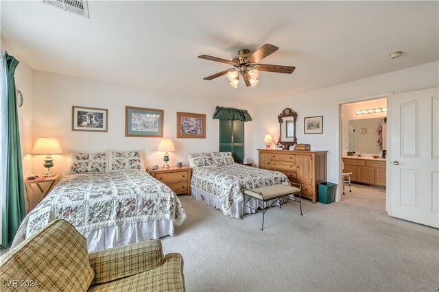 carpeted bedroom featuring connected bathroom and ceiling fan