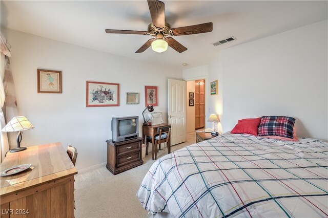 bedroom with ceiling fan and light colored carpet