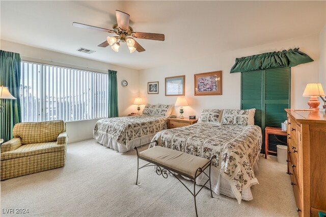 carpeted bedroom featuring ceiling fan