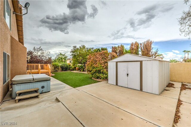 view of patio with a storage unit