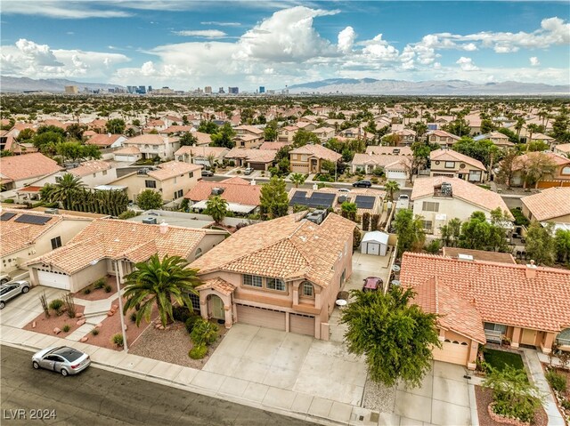 birds eye view of property featuring a mountain view