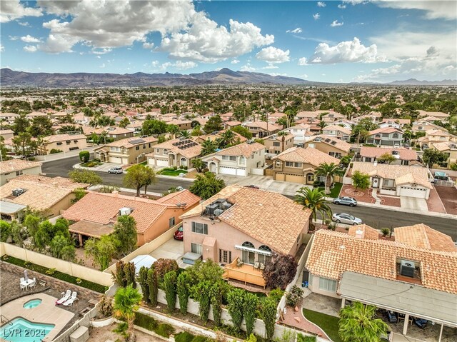 birds eye view of property with a mountain view