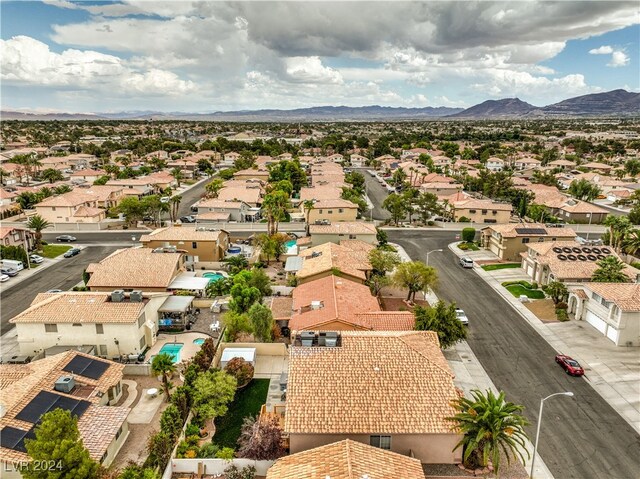 birds eye view of property with a mountain view