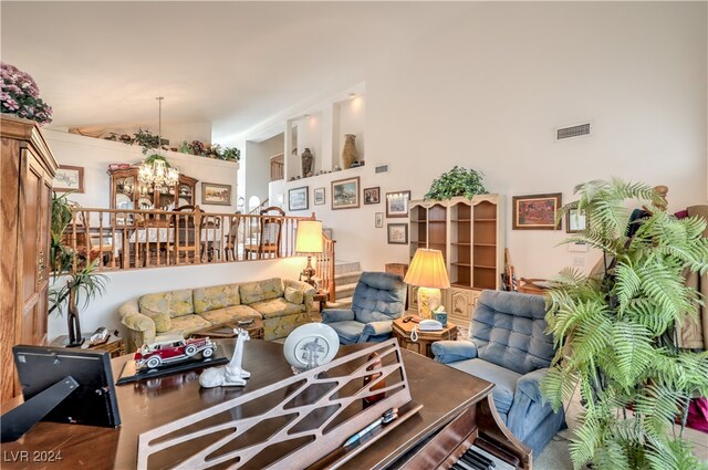 living room featuring a chandelier and hardwood / wood-style flooring