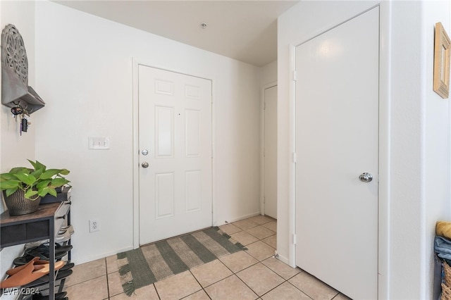 entrance foyer featuring light tile patterned floors