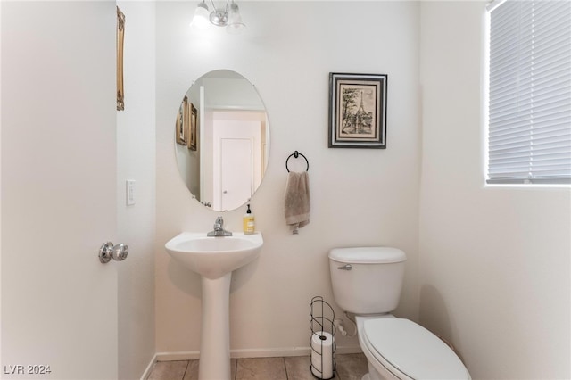 bathroom with tile patterned flooring, sink, and toilet