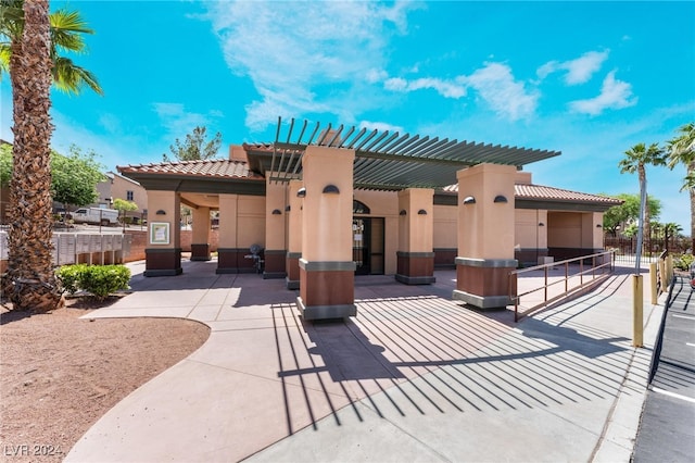 view of front of home with a patio and a pergola