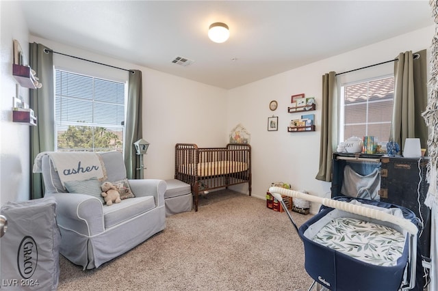 bedroom with carpet flooring and multiple windows