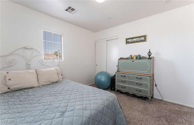 carpeted bedroom featuring a closet