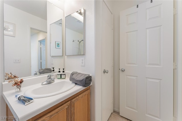 bathroom with vanity and tile patterned floors