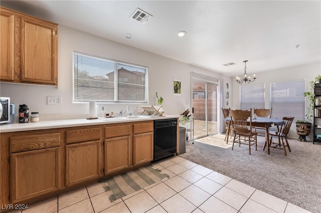 kitchen featuring dishwasher, decorative light fixtures, a healthy amount of sunlight, light colored carpet, and a notable chandelier