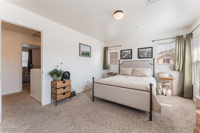 bedroom with light carpet