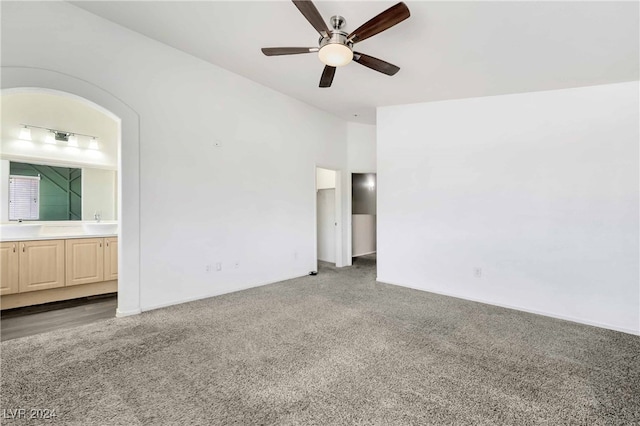 empty room with carpet and ceiling fan