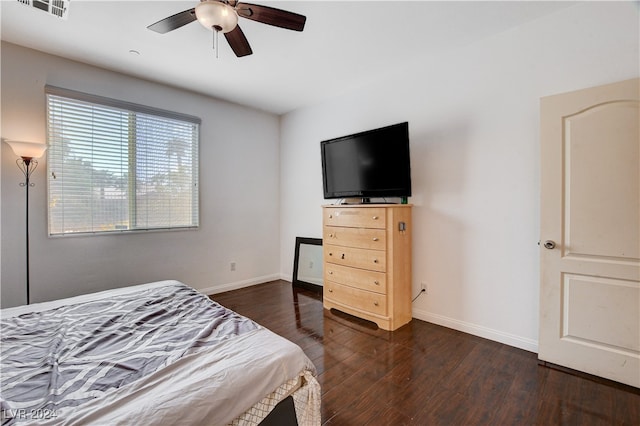 bedroom featuring dark wood-type flooring and ceiling fan