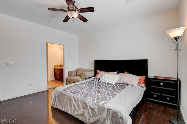 bedroom with ceiling fan, dark hardwood / wood-style floors, and ensuite bathroom