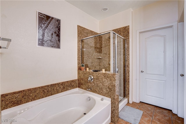 bathroom featuring independent shower and bath and tile patterned flooring