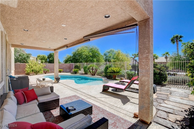 view of swimming pool featuring an outdoor hangout area and a patio