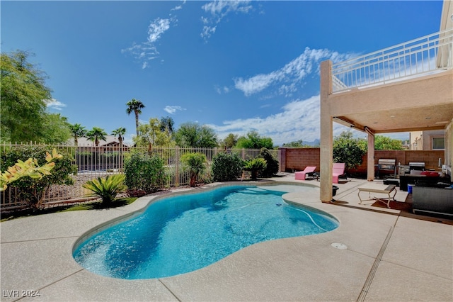 view of swimming pool with an outdoor living space and a patio area