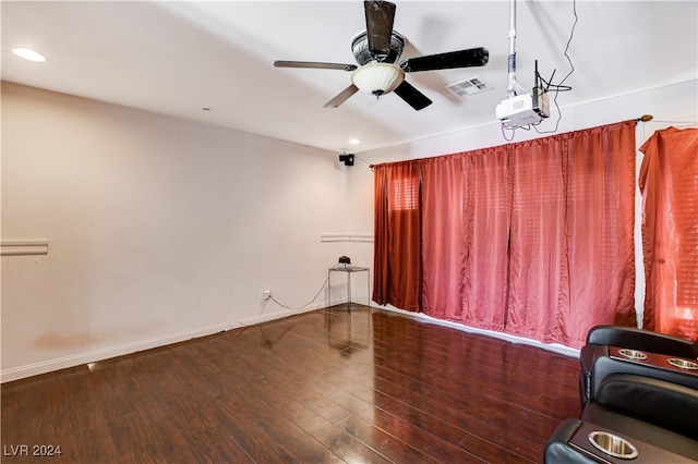 interior space with ceiling fan and wood-type flooring