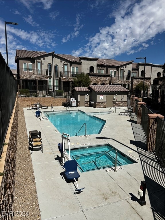 view of pool featuring a patio area