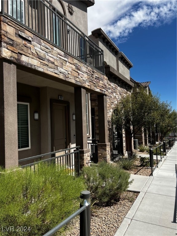 doorway to property with a balcony