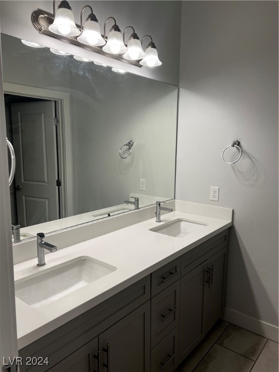 bathroom with tile patterned flooring and vanity