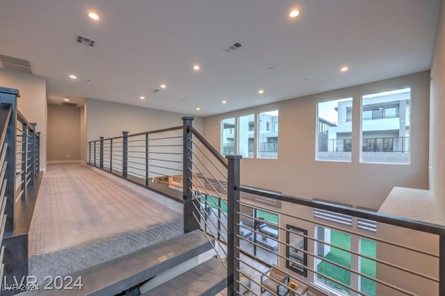 staircase with carpet floors