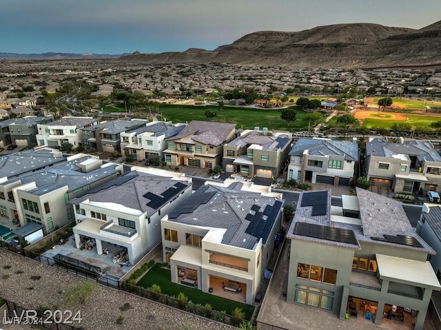 birds eye view of property featuring a mountain view