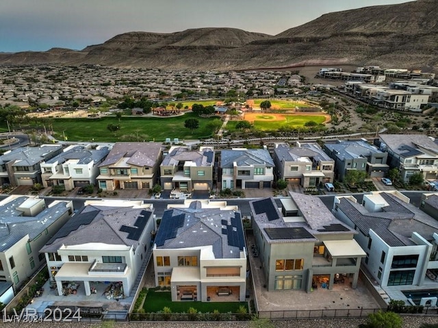 birds eye view of property with a mountain view