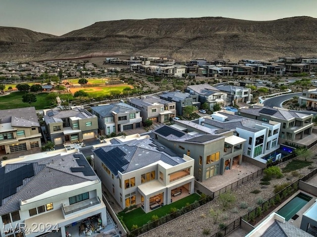 aerial view at dusk with a mountain view