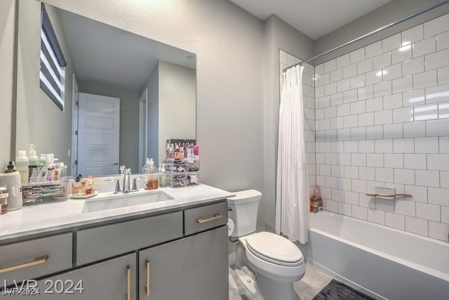 full bathroom with vanity, toilet, and shower / tub combo with curtain