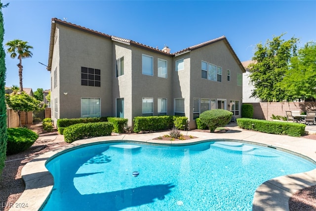 view of swimming pool with a patio area