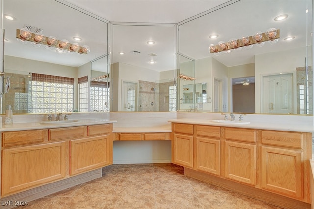 bathroom featuring vanity, walk in shower, and ceiling fan